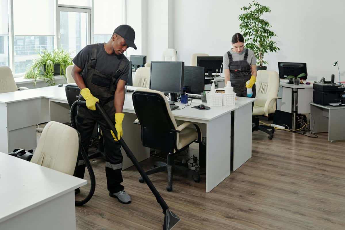 commercial cleaning Camden office team disinfecting workspace